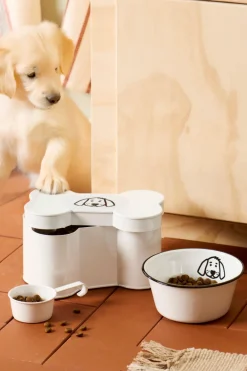 Dåse formet som kødben m/hundemotiv og målebæger